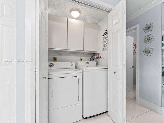 10942 W Sample Rd Unit E1, Coral Springs, FL 33065 - laundry area featuring cabinet space, washing machine and clothes dryer, light tile patterned floors, and crown molding