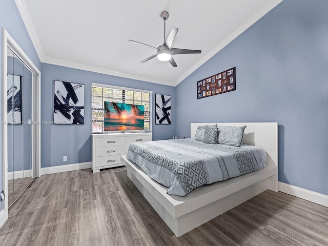 10942 W Sample Rd Unit E1, Coral Springs, FL 33065 - bedroom featuring vaulted ceiling, wood finished floors, ornamental molding, and ceiling fan