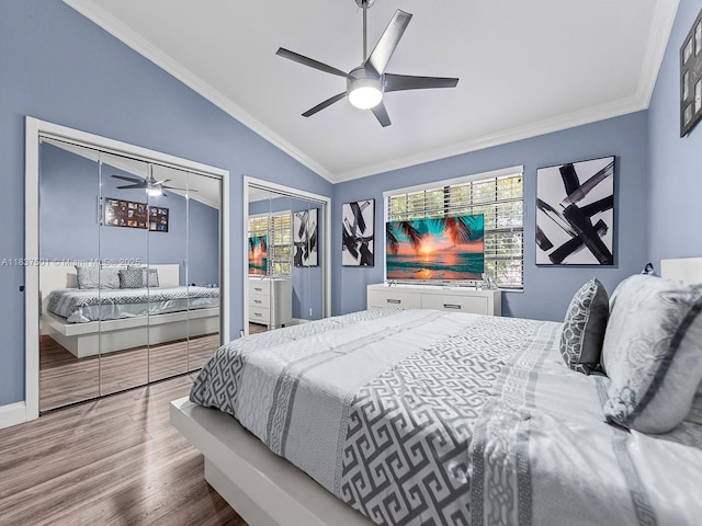 10942 W Sample Rd Unit E1, Coral Springs, FL 33065 - bedroom featuring multiple windows, vaulted ceiling, wood finished floors, ornamental molding, and ceiling fan
