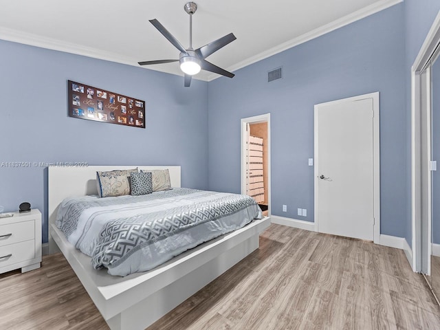 10942 W Sample Rd Unit E1, Coral Springs, FL 33065 - bedroom with ornamental molding, wood finished floors, ceiling fan, and ensuite bathroom