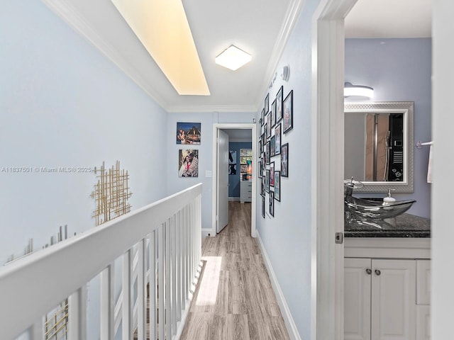 10942 W Sample Rd Unit E1, Coral Springs, FL 33065 - hall featuring light wood-style flooring and crown molding