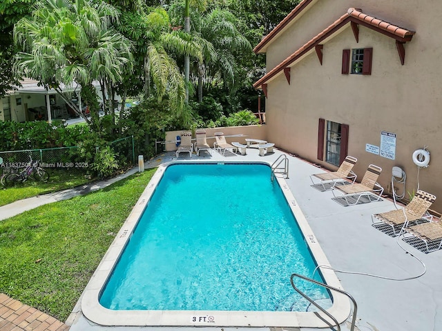 10942 W Sample Rd Unit E1, Coral Springs, FL 33065 - community pool featuring a patio area