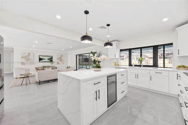 220 SW 75th Ter, Plantation, FL 33317 - kitchen with beverage cooler, light marble finish floors, recessed lighting, a center island, and hanging light fixtures