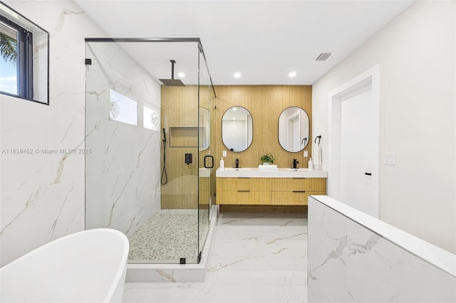 220 SW 75th Ter, Plantation, FL 33317 - full bathroom with marble tiled floors, a marble finish shower, a freestanding tub, double vanity, and recessed lighting
