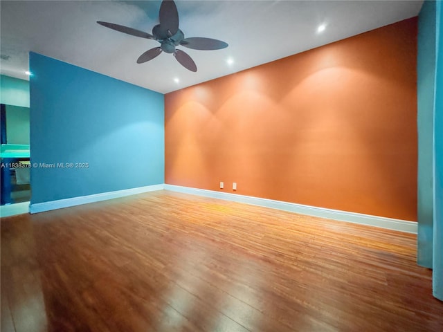 2880 S Carambola Cir S Unit 2071, Coconut Creek, FL 33066 - unfurnished room with wood finished floors, ceiling fan, and recessed lighting