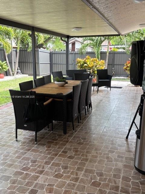 450 SW 89th Ct, Miami, FL 33174 - fenced backyard featuring outdoor dining area and a patio