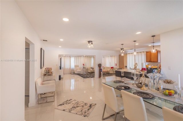 2841 NW 9th Ave, Wilton Manors, FL 33311 - kitchen featuring recessed lighting, open floor plan, brown cabinets, and decorative light fixtures