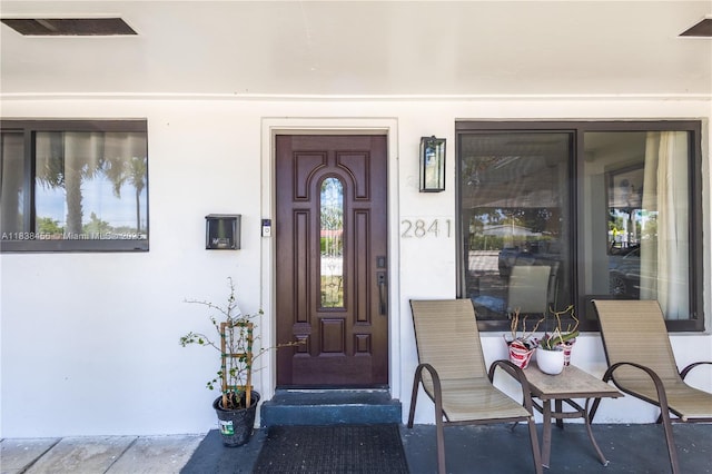 2841 NW 9th Ave, Wilton Manors, FL 33311 - property entrance with stucco siding and a porch