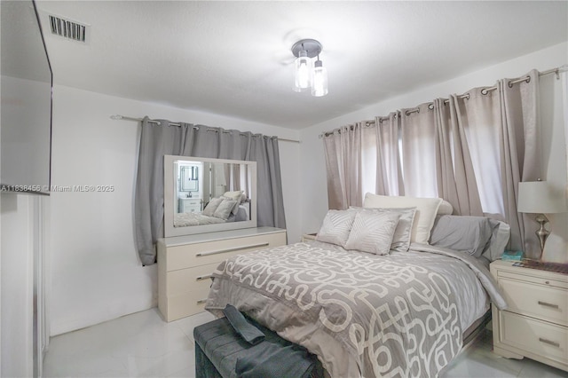 2841 NW 9th Ave, Wilton Manors, FL 33311 - bedroom featuring light marble finish floors