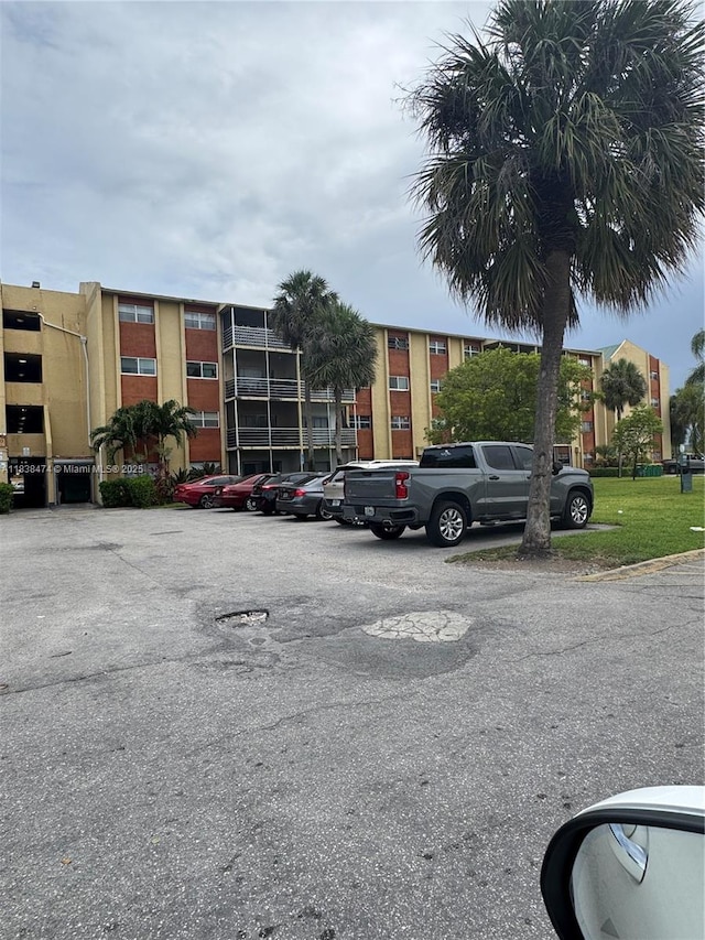 3610 NW 21st St Unit 413, Lauderdale Lakes, FL 33311 - view of building exterior featuring uncovered parking