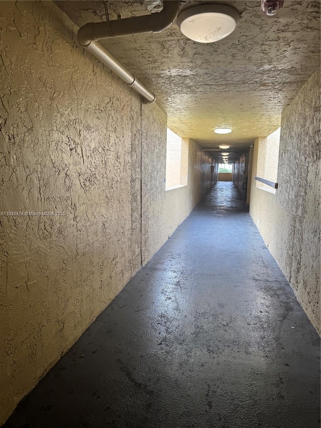 3610 NW 21st St Unit 413, Lauderdale Lakes, FL 33311 - corridor with unfinished concrete floors