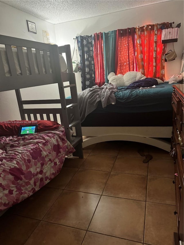 3610 NW 21st St Unit 413, Lauderdale Lakes, FL 33311 - bedroom with a textured ceiling and tile patterned floors