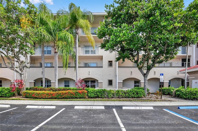 5938 Crystal Shores Dr Unit 103, Boynton Beach, FL 33437 - view of apartment building / complex with uncovered parking