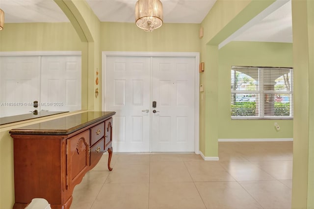 5938 Crystal Shores Dr Unit 103, Boynton Beach, FL 33437 - foyer entrance with arched walkways and light tile patterned floors