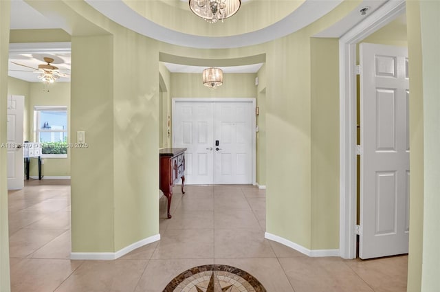 5938 Crystal Shores Dr Unit 103, Boynton Beach, FL 33437 - entryway featuring a chandelier, light tile patterned floors, and a ceiling fan