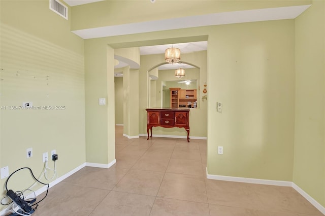 5938 Crystal Shores Dr Unit 103, Boynton Beach, FL 33437 - corridor featuring arched walkways and light tile patterned floors