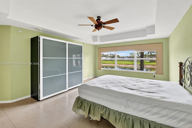 5938 Crystal Shores Dr Unit 103, Boynton Beach, FL 33437 - tiled bedroom with a raised ceiling and a ceiling fan