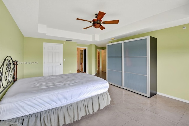 5938 Crystal Shores Dr Unit 103, Boynton Beach, FL 33437 - bedroom with a tray ceiling, a ceiling fan, and a closet