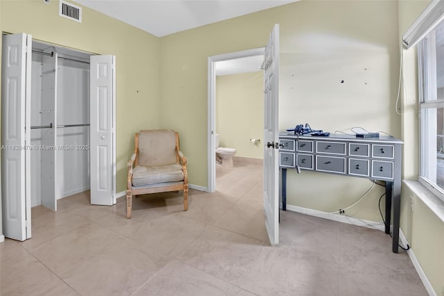 5938 Crystal Shores Dr Unit 103, Boynton Beach, FL 33437 - living area with baseboards and light tile patterned floors