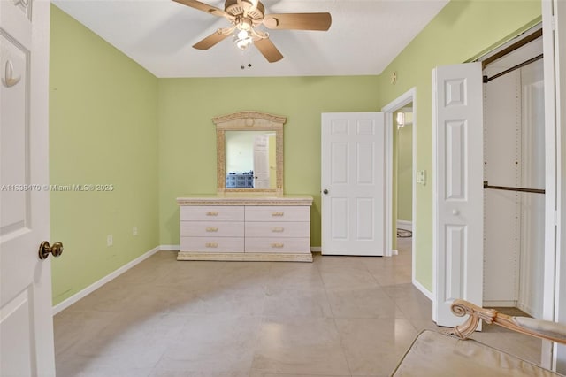 5938 Crystal Shores Dr Unit 103, Boynton Beach, FL 33437 - unfurnished bedroom featuring light tile patterned flooring and ceiling fan