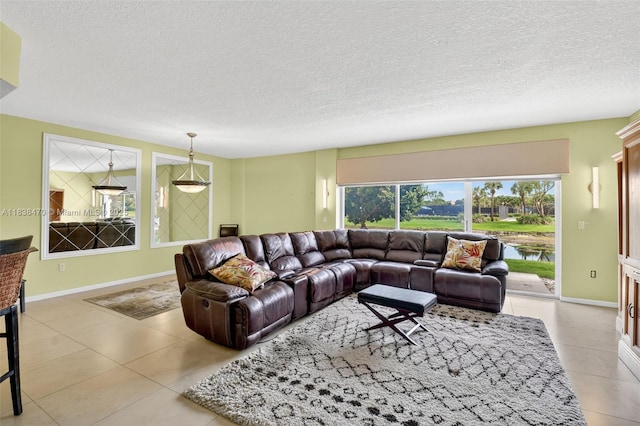 5938 Crystal Shores Dr Unit 103, Boynton Beach, FL 33437 - living room with light tile patterned flooring and a textured ceiling