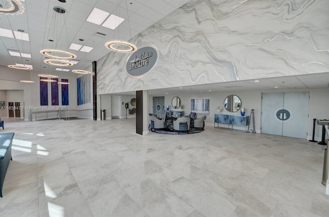 5938 Crystal Shores Dr Unit 103, Boynton Beach, FL 33437 - building lobby featuring a towering ceiling and a drop ceiling