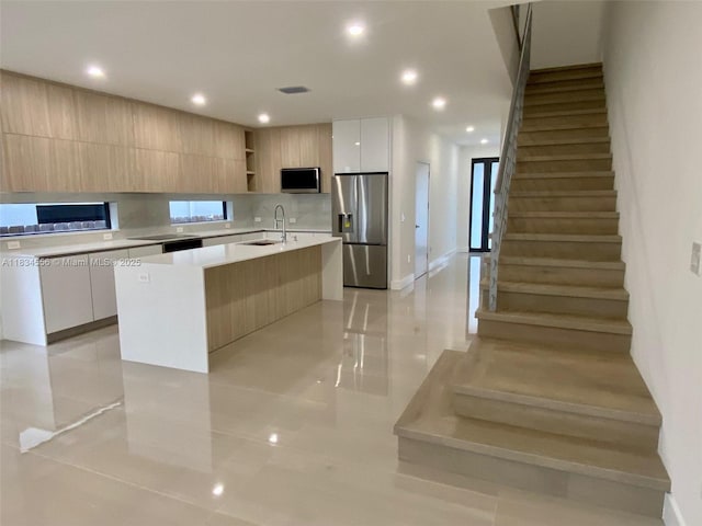 313 SW 10th St Unit A, Fort Lauderdale, FL 33315 - kitchen with stainless steel appliances, modern cabinets, open shelves, light countertops, and light tile patterned floors