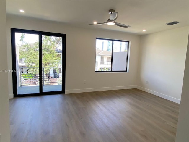 313 SW 10th St Unit A, Fort Lauderdale, FL 33315 - spare room featuring wood finished floors, a ceiling fan, and recessed lighting