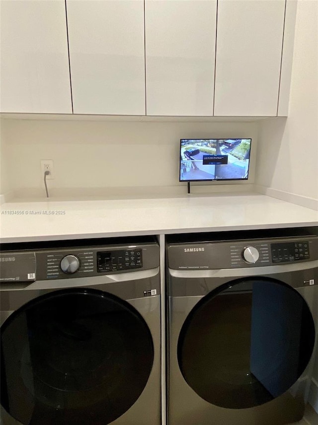 313 SW 10th St Unit A, Fort Lauderdale, FL 33315 - laundry area featuring separate washer and dryer and cabinet space