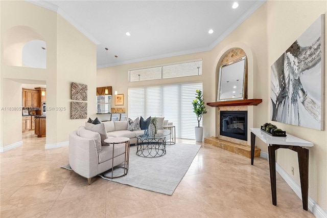 1504 NW 182nd Ave, Pembroke Pines, FL 33029 - living area featuring crown molding, a high end fireplace, a high ceiling, and recessed lighting