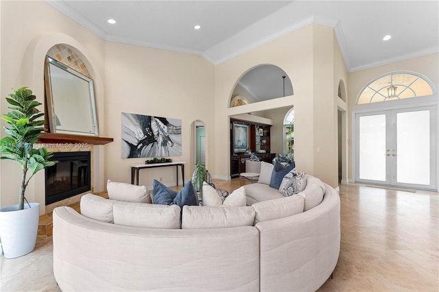 1504 NW 182nd Ave, Pembroke Pines, FL 33029 - living room with french doors, recessed lighting, plenty of natural light, ornamental molding, and a glass covered fireplace