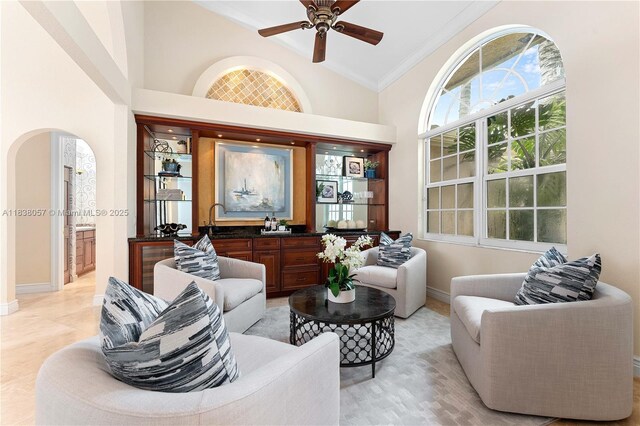 1504 NW 182nd Ave, Pembroke Pines, FL 33029 - living area with arched walkways, ceiling fan, crown molding, and high vaulted ceiling