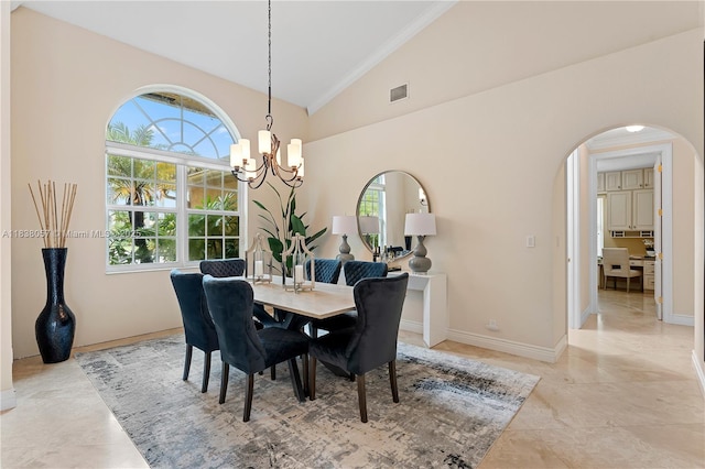 1504 NW 182nd Ave, Pembroke Pines, FL 33029 - dining space with a chandelier, arched walkways, vaulted ceiling, plenty of natural light, and crown molding