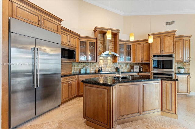 1504 NW 182nd Ave, Pembroke Pines, FL 33029 - kitchen with built in appliances, wall chimney exhaust hood, brown cabinets, and crown molding