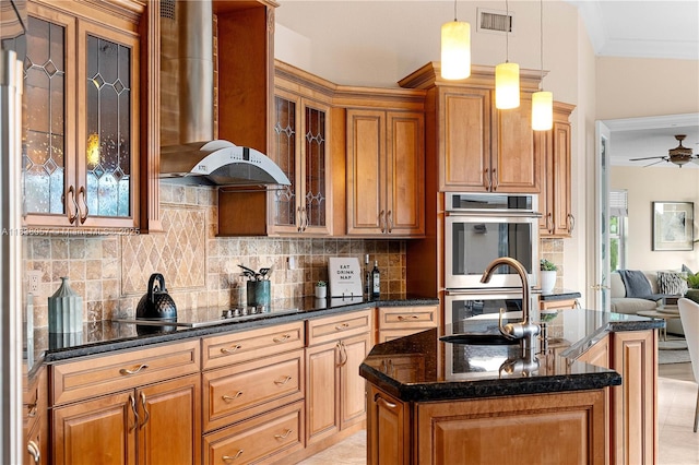 1504 NW 182nd Ave, Pembroke Pines, FL 33029 - kitchen with wall chimney exhaust hood, stainless steel double oven, ornamental molding, ceiling fan, and backsplash