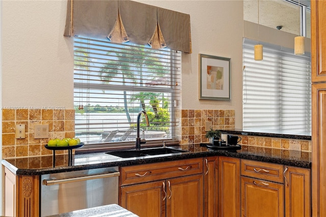 1504 NW 182nd Ave, Pembroke Pines, FL 33029 - kitchen featuring dishwasher, decorative backsplash, brown cabinetry, a textured wall, and dark stone counters