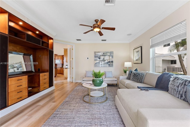 1504 NW 182nd Ave, Pembroke Pines, FL 33029 - living area with light wood-type flooring, crown molding, a ceiling fan, and recessed lighting