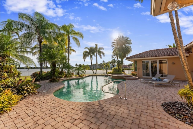 1504 NW 182nd Ave, Pembroke Pines, FL 33029 - view of pool featuring a patio, a fenced backyard, and a pool with connected hot tub