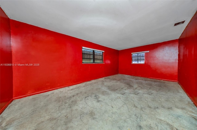 3300 NW 211th St, Miami Gardens, FL 33056 - empty room featuring carpet floors and vaulted ceiling
