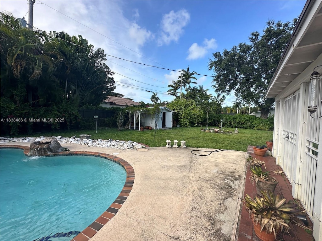 8751 SW 110th St, Miami, FL 33176 - outdoor pool featuring a yard, a patio, and a shed