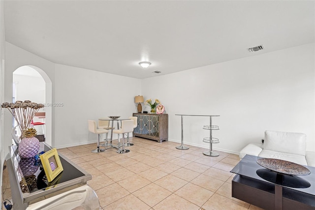771 SE 2nd St, Homestead, FL 33030 - living area featuring arched walkways and light tile patterned floors