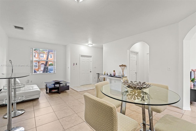 771 SE 2nd St, Homestead, FL 33030 - dining room featuring arched walkways and light tile patterned flooring
