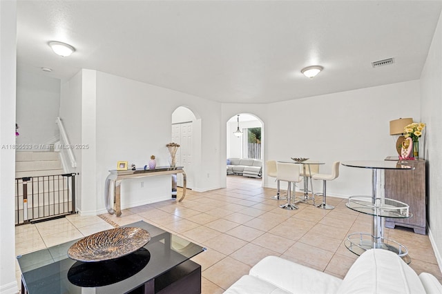 771 SE 2nd St, Homestead, FL 33030 - living area with arched walkways and light tile patterned floors