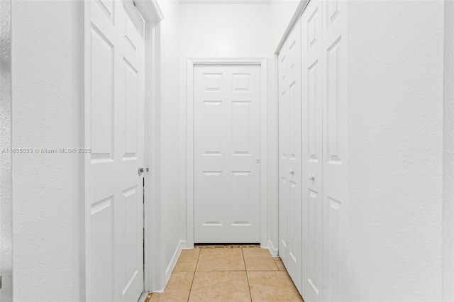 771 SE 2nd St, Homestead, FL 33030 - corridor featuring light tile patterned floors and a textured wall