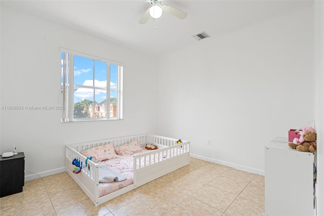 771 SE 2nd St, Homestead, FL 33030 - tiled bedroom featuring a nursery area and ceiling fan