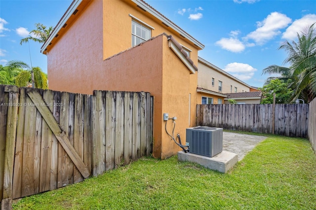 771 SE 2nd St, Homestead, FL 33030 - view of side of home with stucco siding, a fenced backyard, and a patio