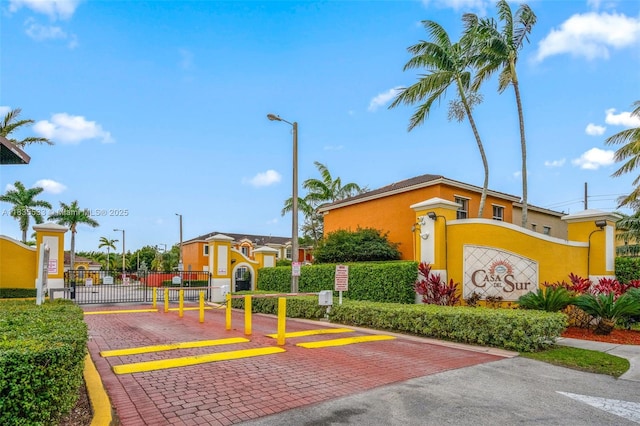 771 SE 2nd St, Homestead, FL 33030 - view of decorative street featuring street lighting, a gated entry, a gate, and curbs