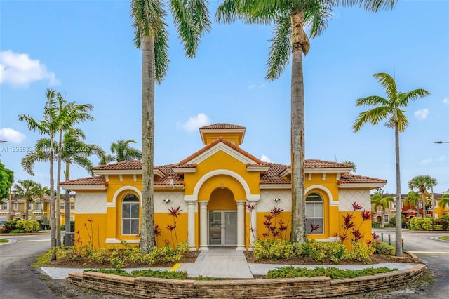 771 SE 2nd St, Homestead, FL 33030 - view of front of home featuring french doors, stucco siding, and a tiled roof