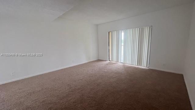 5200 NW 31st Ave Unit 217, Fort Lauderdale, FL 33309 - carpeted empty room with baseboards