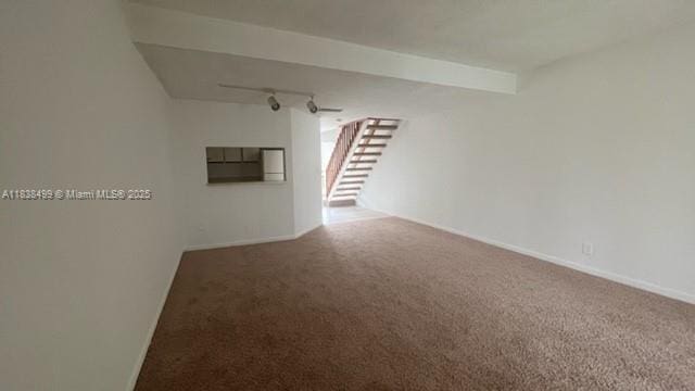 5200 NW 31st Ave Unit 217, Fort Lauderdale, FL 33309 - unfurnished room featuring carpet, track lighting, and stairs